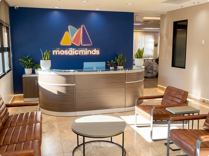 Healthcare welcome lobby with branded reception desk and visitor seating