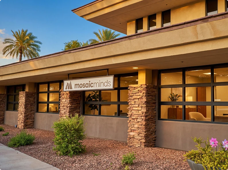 Two-story treatment center exterior with covered entrance and landscaped grounds